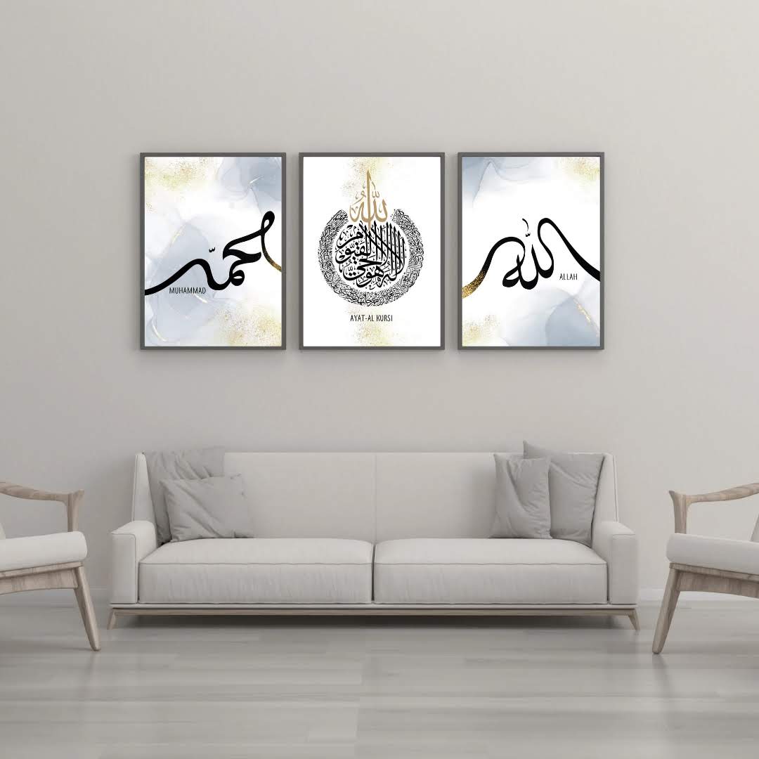 Three framed calligraphy prints, Muhammad, Ayat al Kursi and Allah, hung above a pale sofa in a living room
